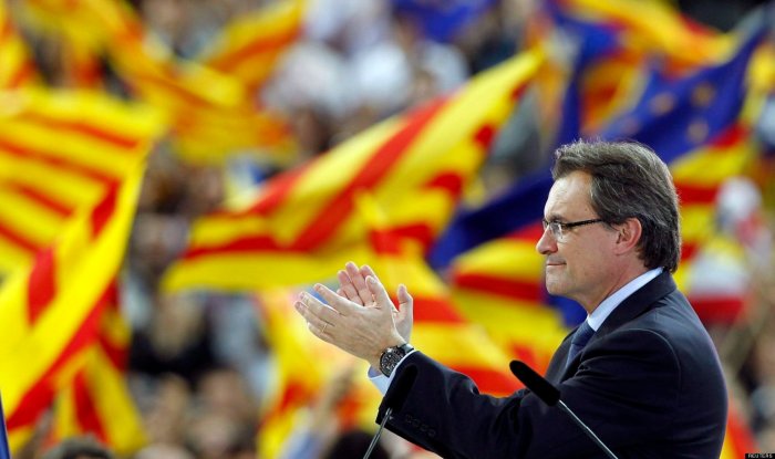 Convergencia i Unio (CIU) party's candidate Artur Mas for Catalunya's regional government claps during a meeting in Barcelona