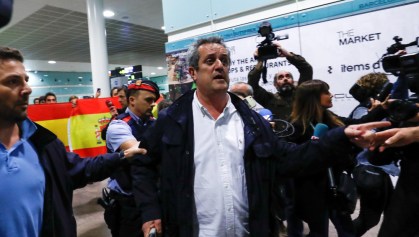 Sacked Catalan government interior minister Joaquim Forn walks after landing at the airport from Brussels, in Barcelona